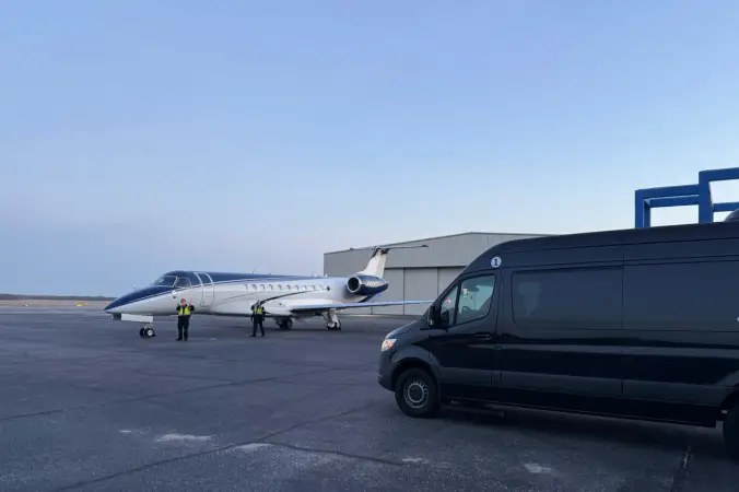 Early morning private jet transfer with Sprinter van waiting nearby