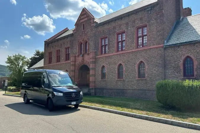 Sprinter van parked outside a NYC venue for group transportation