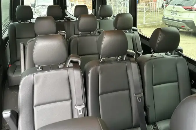 Spacious Sprinter van interior with seating for airport groups