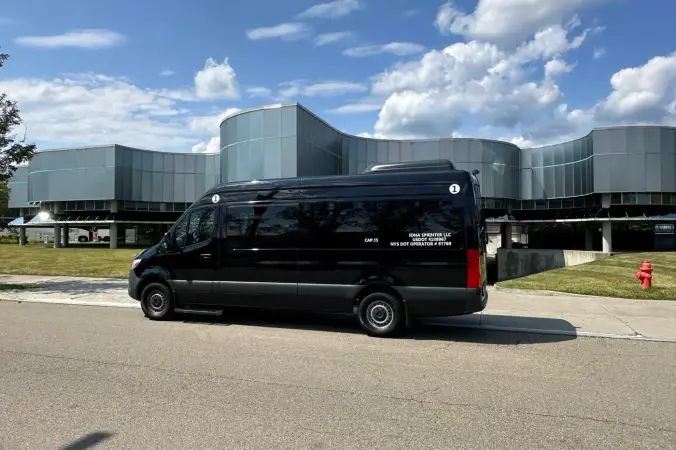 Side profile of Sprinter van used for group airport transportation