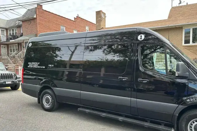 Full side view of 15-passenger Sprinter van for airport groups