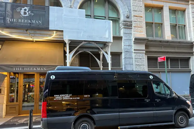 Airport Vans NYC Sprinter van at a Manhattan hotel for private transfers
